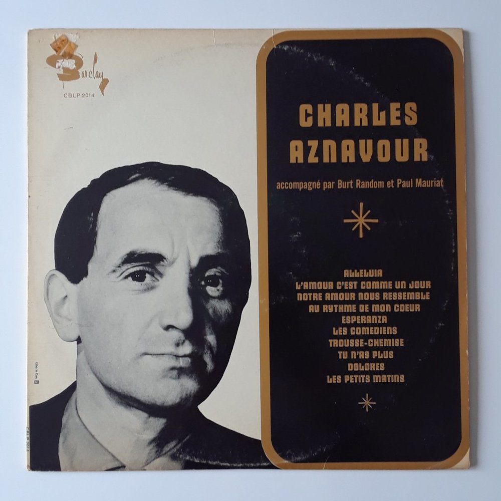 Charles Aznavour. accompagné par Burt Random et Paul Mauriat. 1962